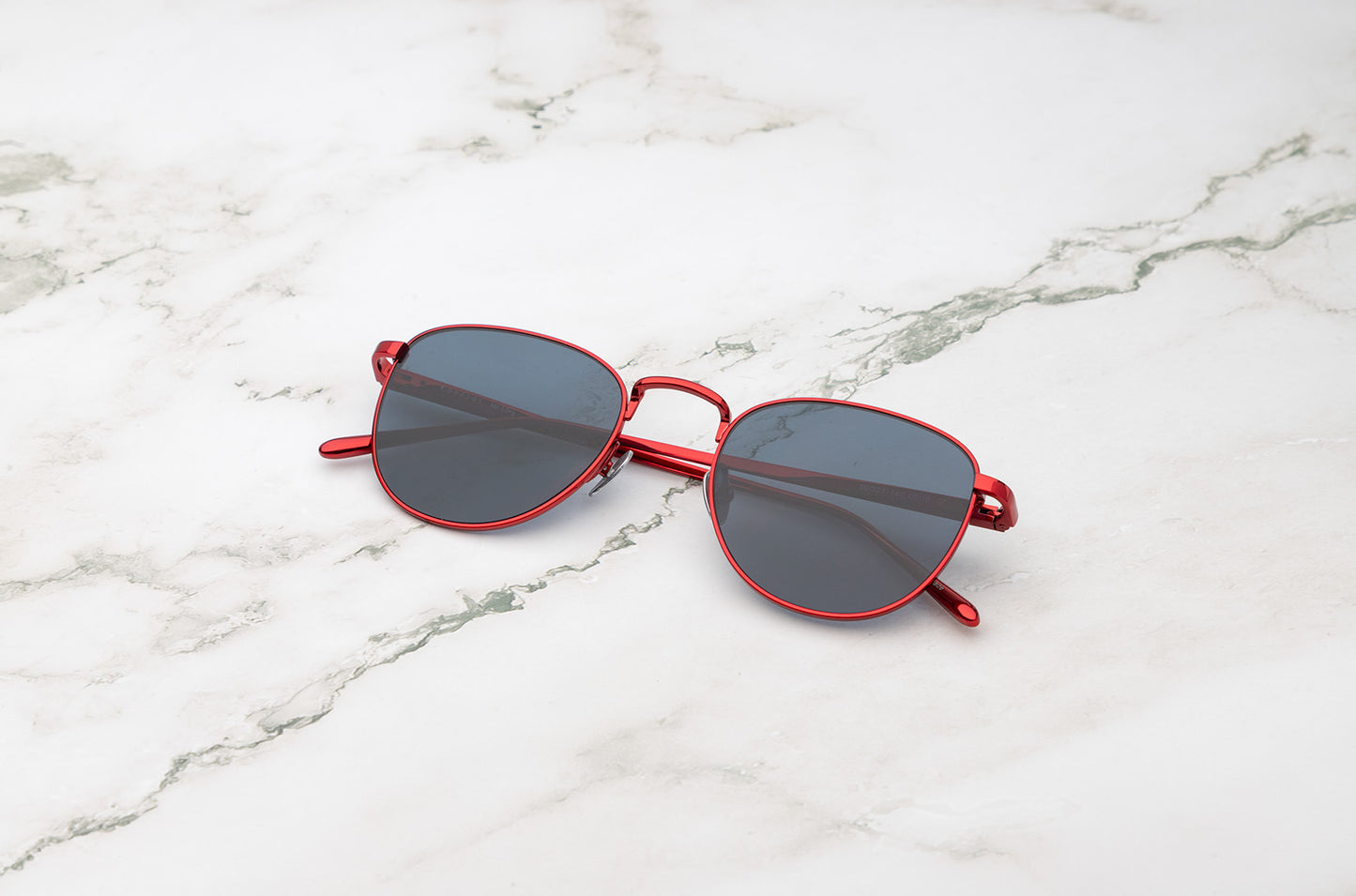 Red aviator sunglasses with polarized black lenses by Kopajos