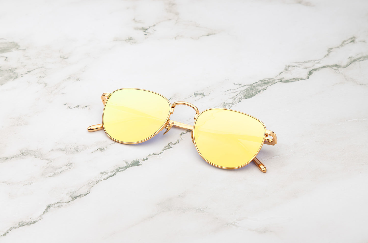 Gold aviator sunglasses with yellow mirror lenses by Kopajos