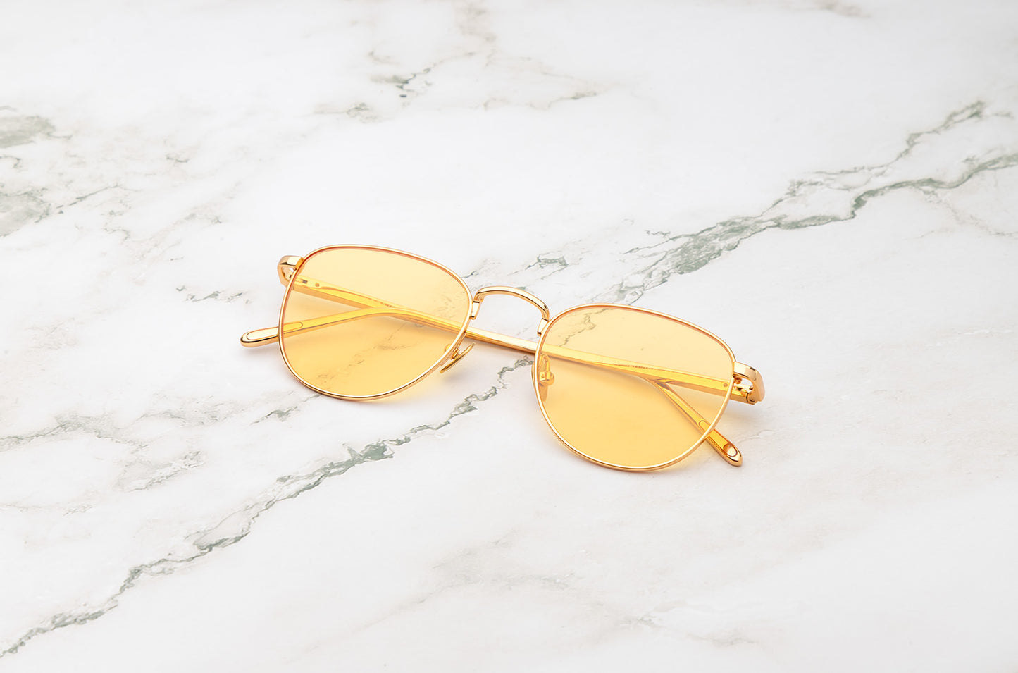 Gold aviator sunglasses with yellow polarized lenses by Kopajos