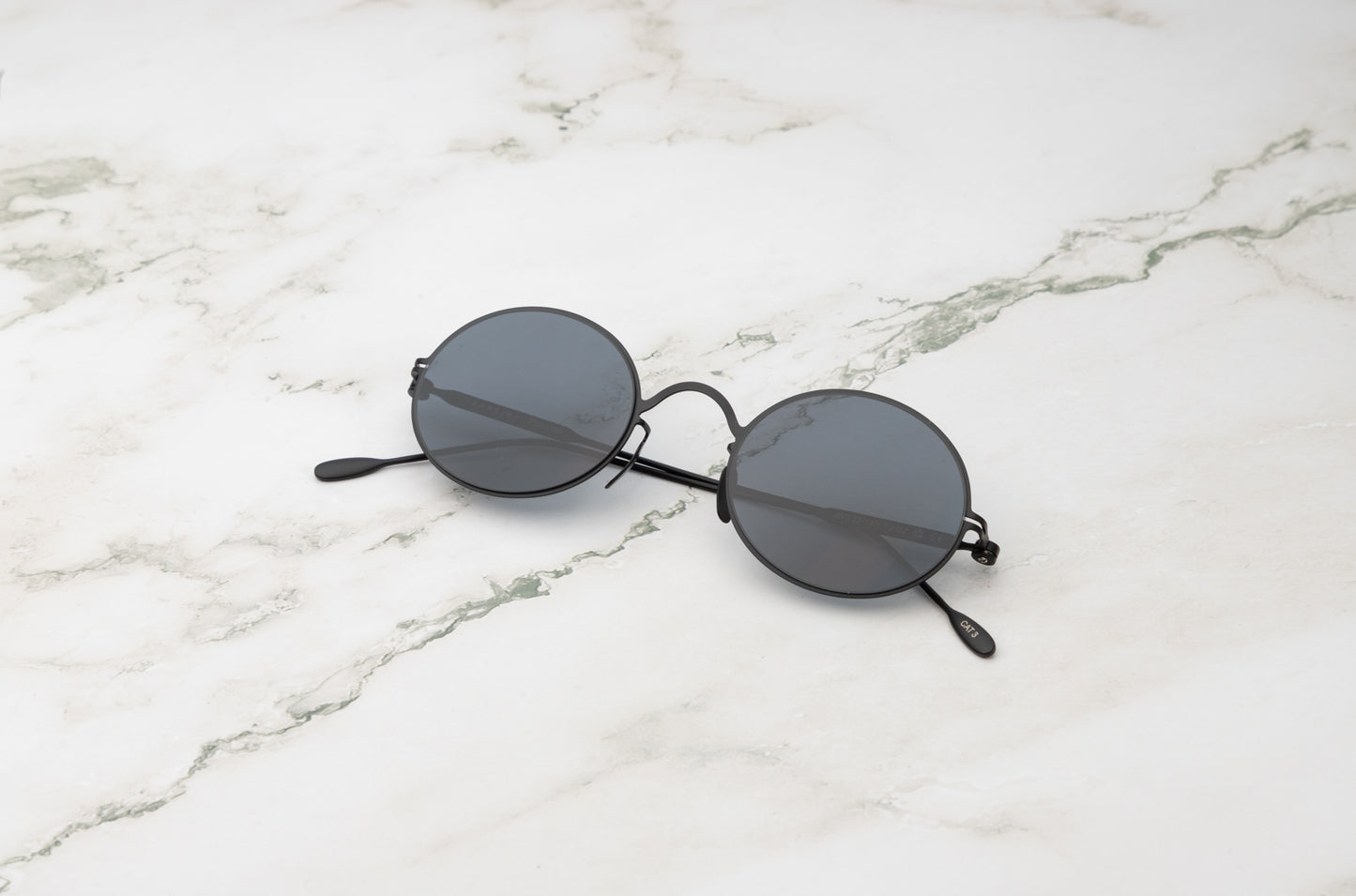 Black round sunglasses for men and women with polarized lenses by Kopajos