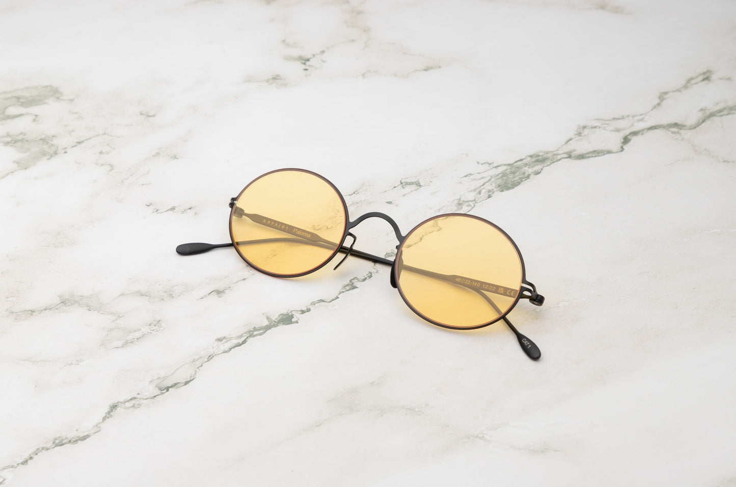 Black round sunglasses for men and women with polarized yellow lenses by Kopajos