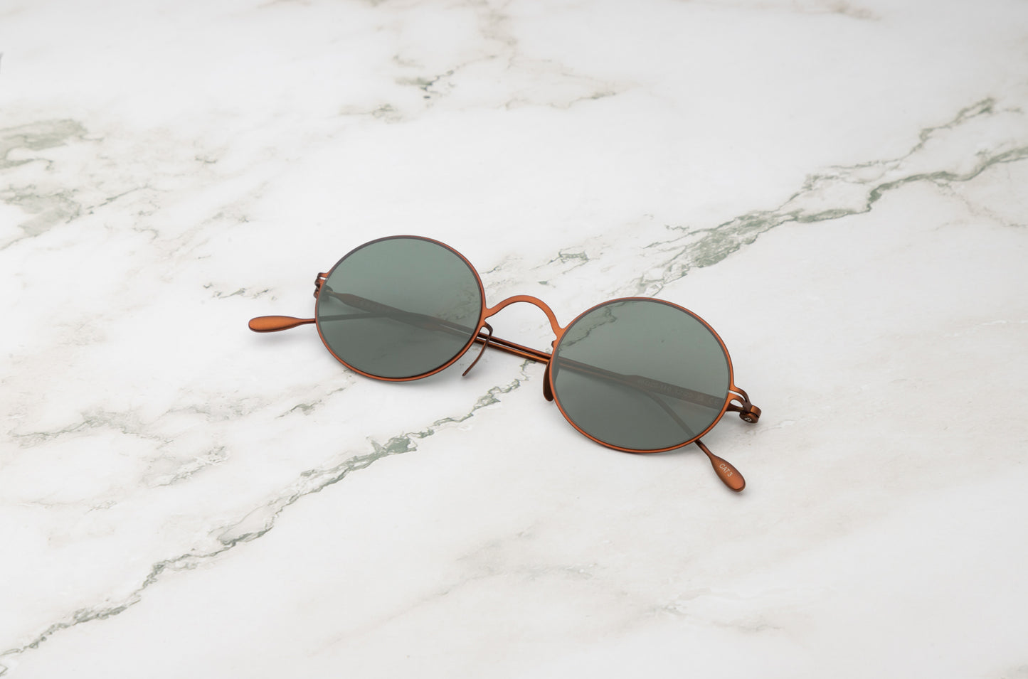 Bronze round sunglasses for men and women with polarized dark green lenses by Kopajos
