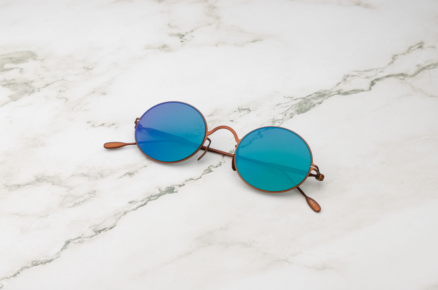 Bronze round sunglasses for men and women with mirror green lenses by Kopajos