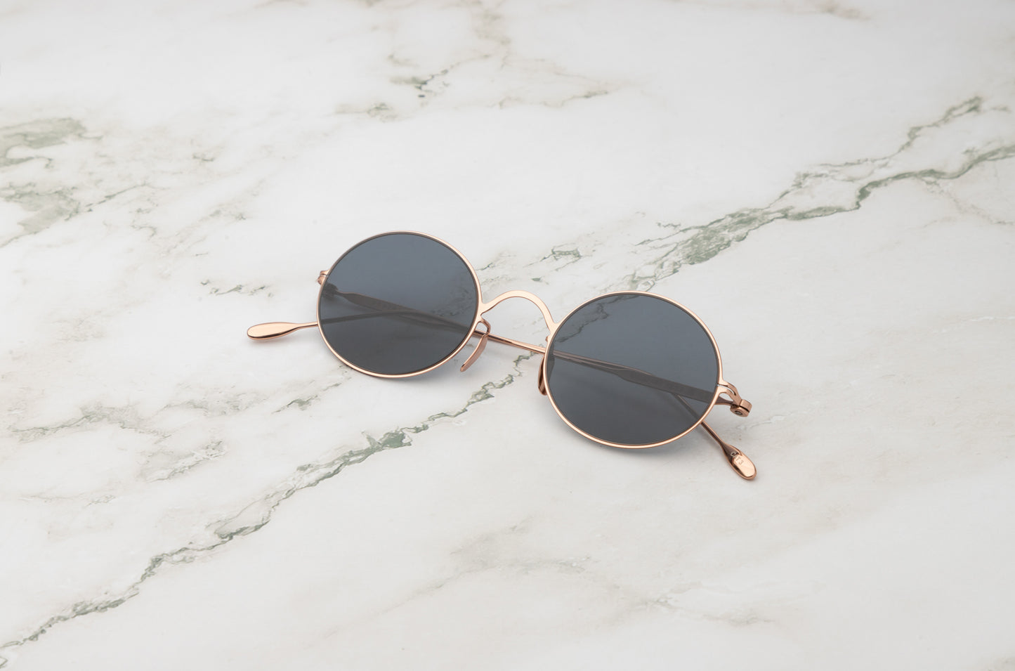 Rose gold round sunglasses for men and women with polarized black lenses by Kopajos