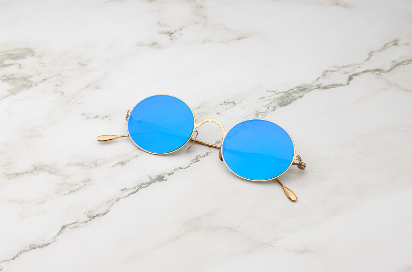 Gold round sunglasses for men and women with polarized blue lenses by Kopajos