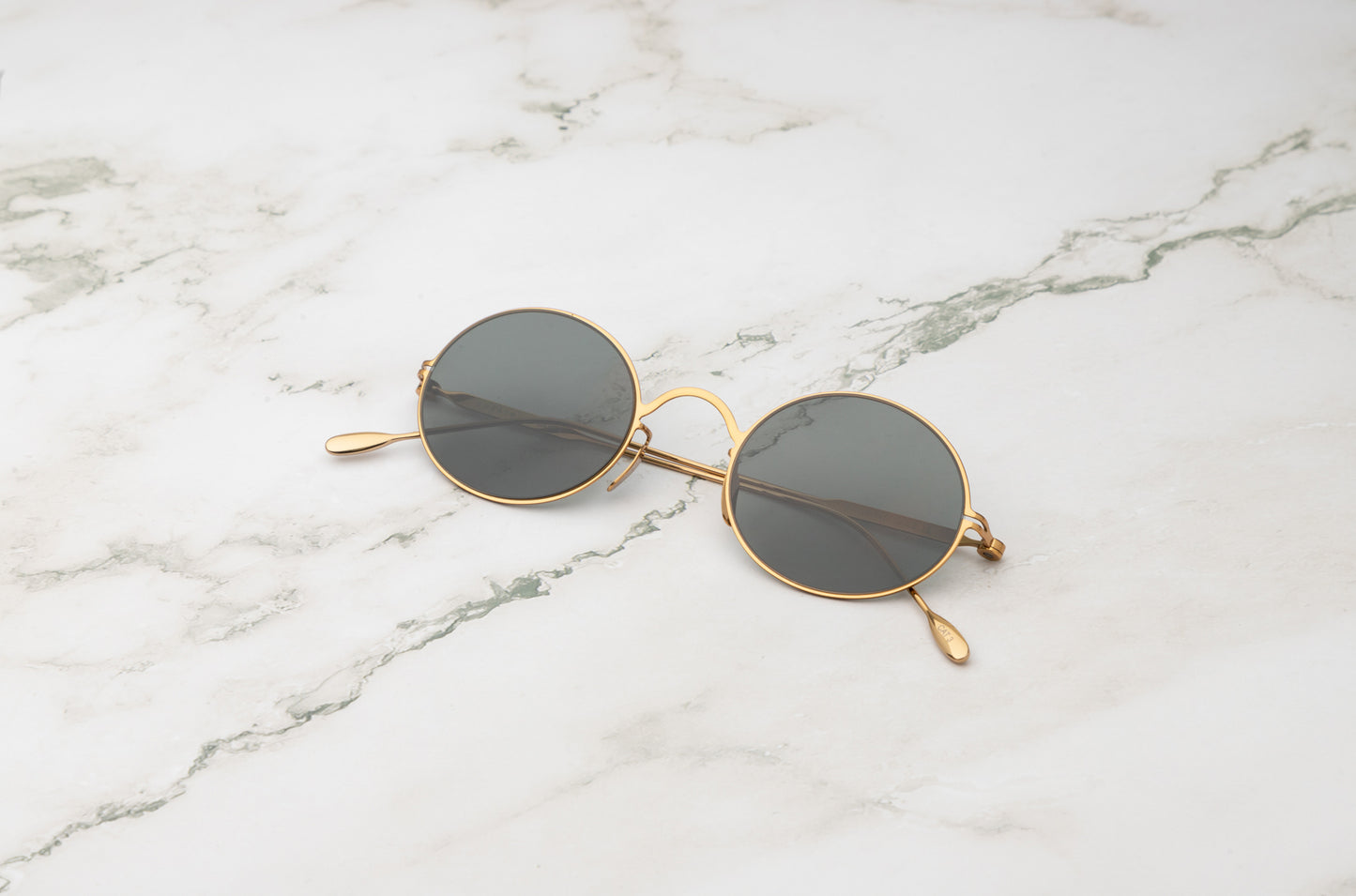Gold round sunglasses for men and women with polarized dark green lenses by Kopajos