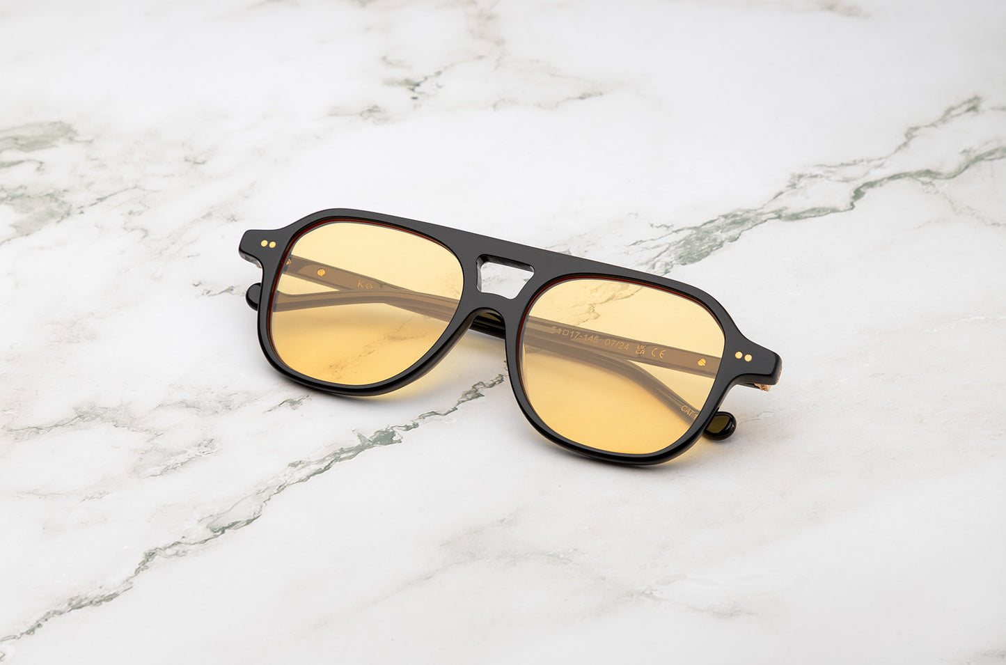 Black aviator sunglasses for men and women with yellow polarized lenses by Kopajos