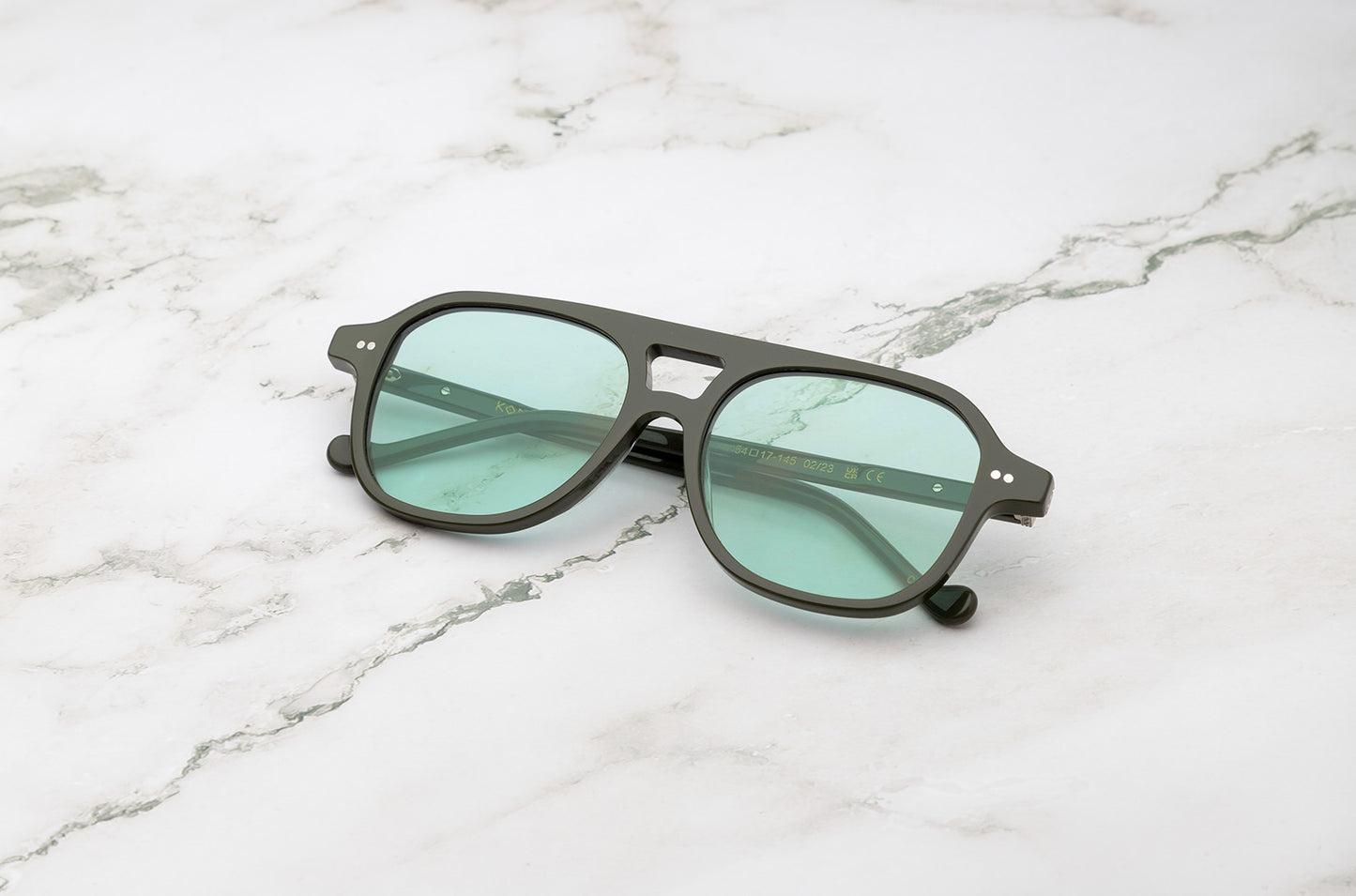 Green aviator sunglasses for men and women with light green lenses by Kopajos
