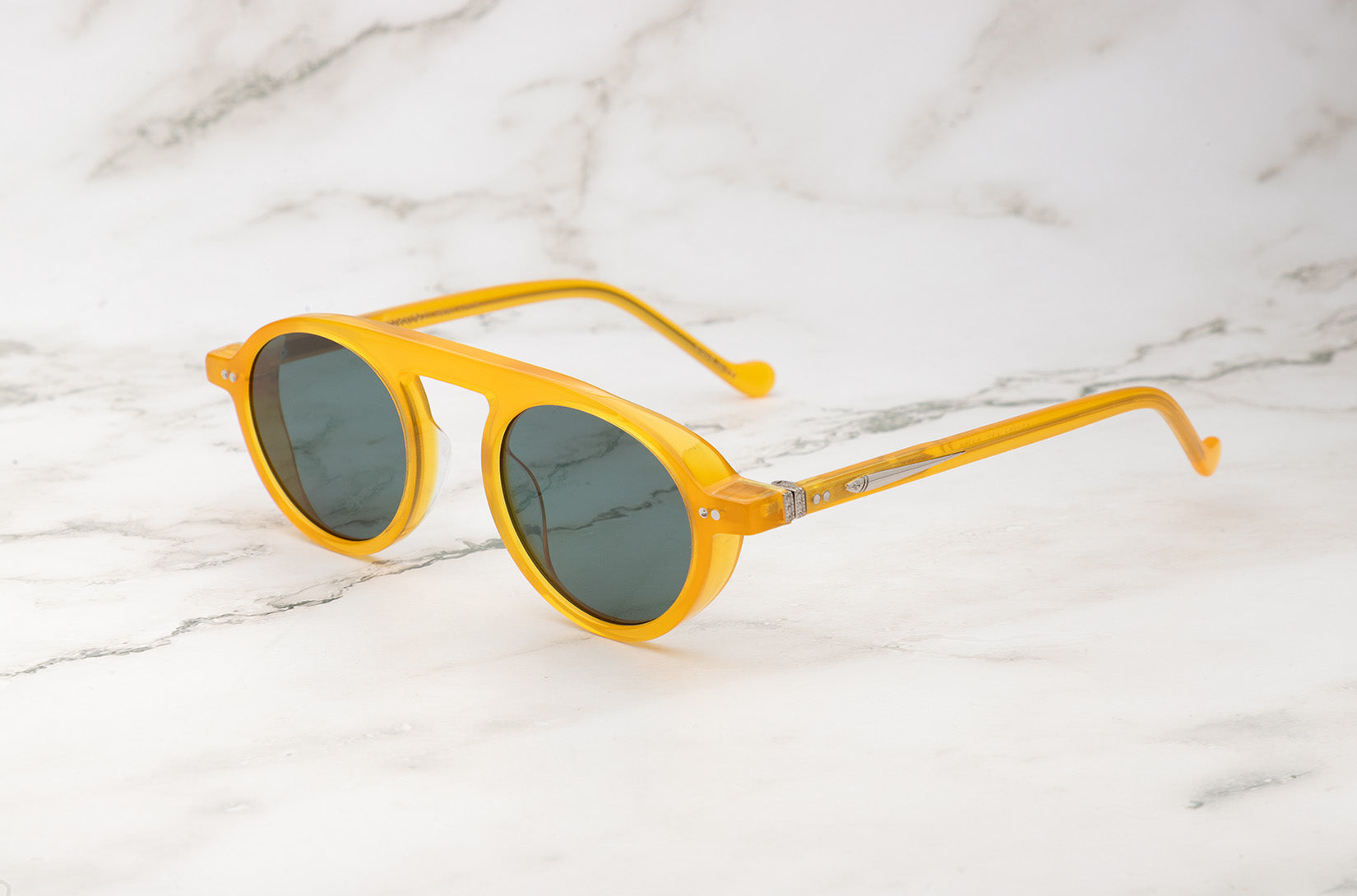 Peter Frank yellow round sunglasses for a person with a square face.