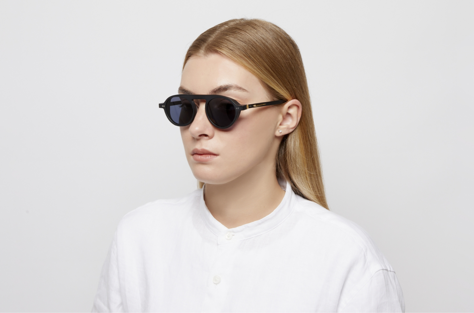 A pair of iconic sunglasses round womens style by Peter Frank.