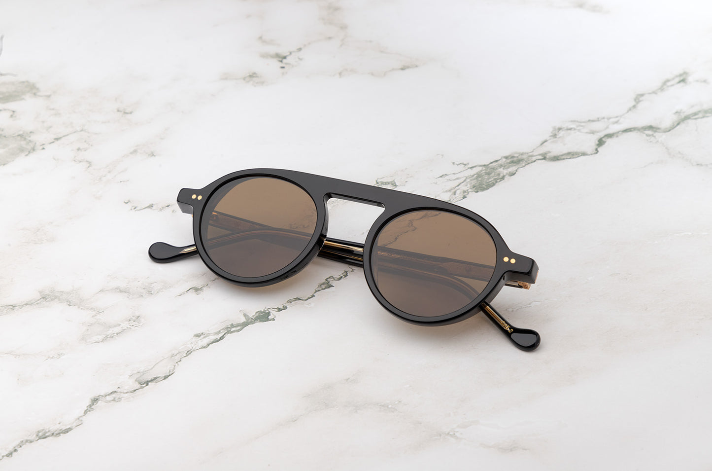 Peter Frank round brown sunglasses, available for purchase.