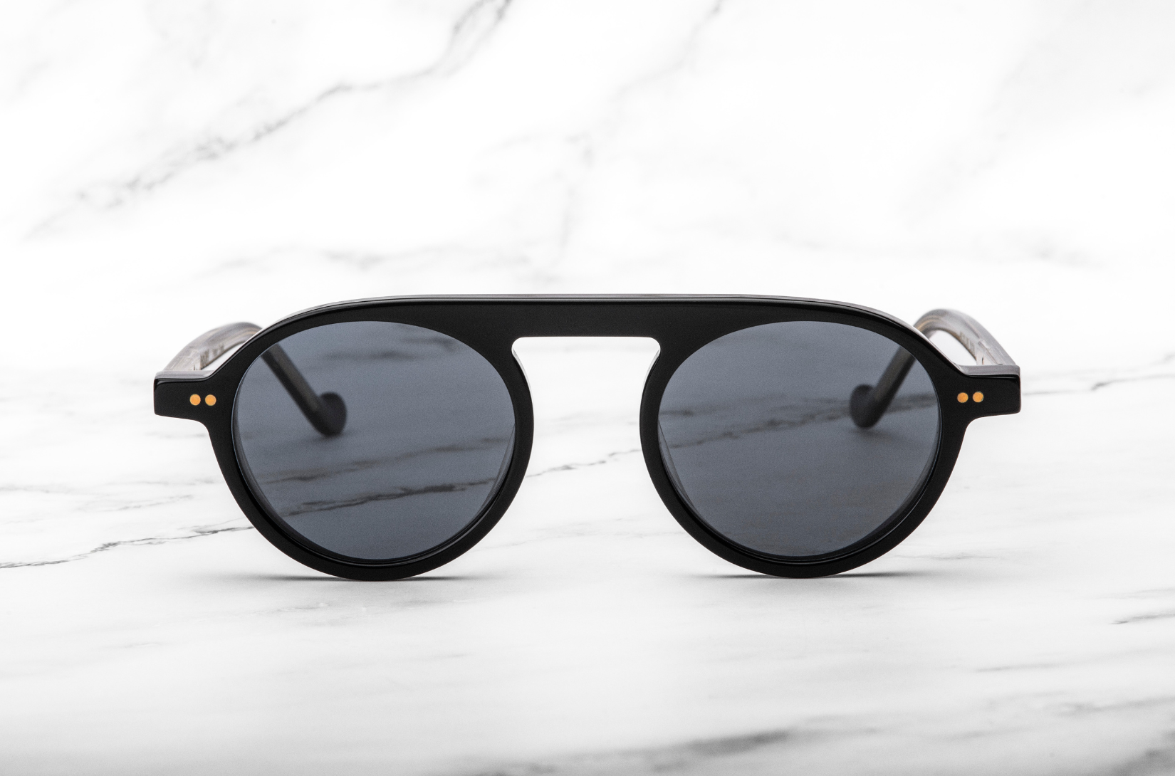 Peter Frank round sunglasses on a white background.