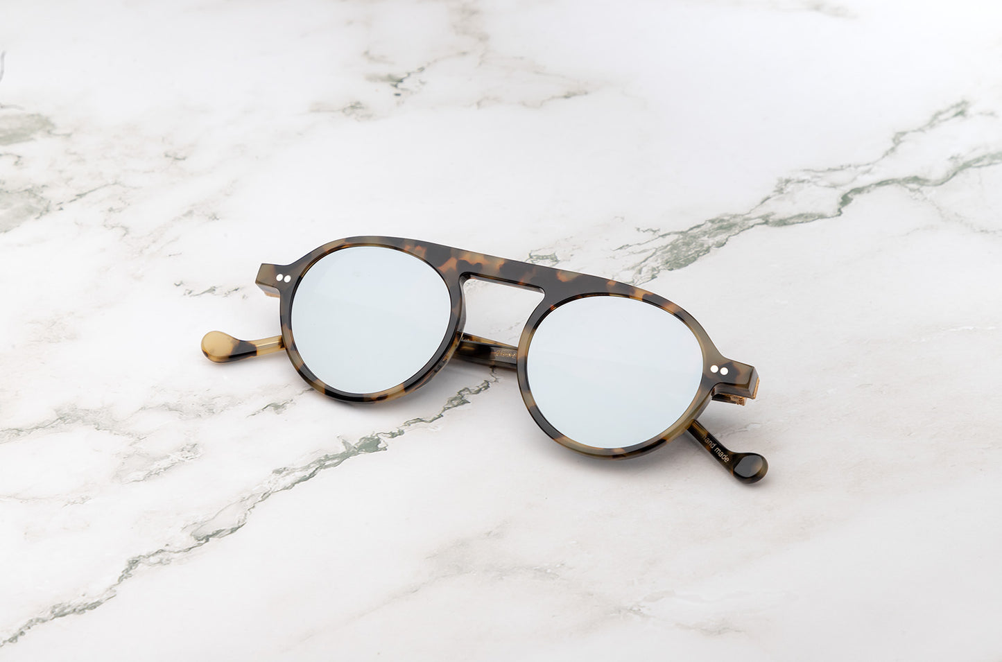 The Peter Frank vintage round sunglasses in a tortoise brown color.