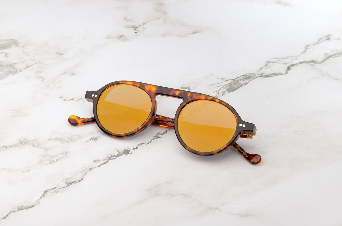 The lightweight comfort of Peter Frank's round tortoise sunglasses.