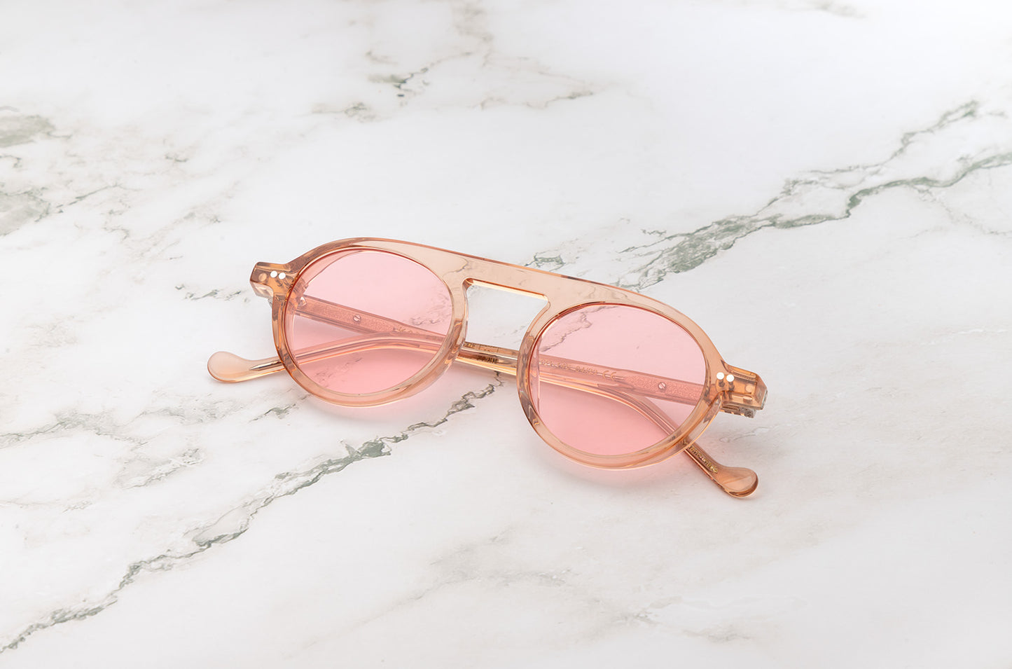 The Peter Frank tiny round sunglasses, a vintage-inspired accessory.