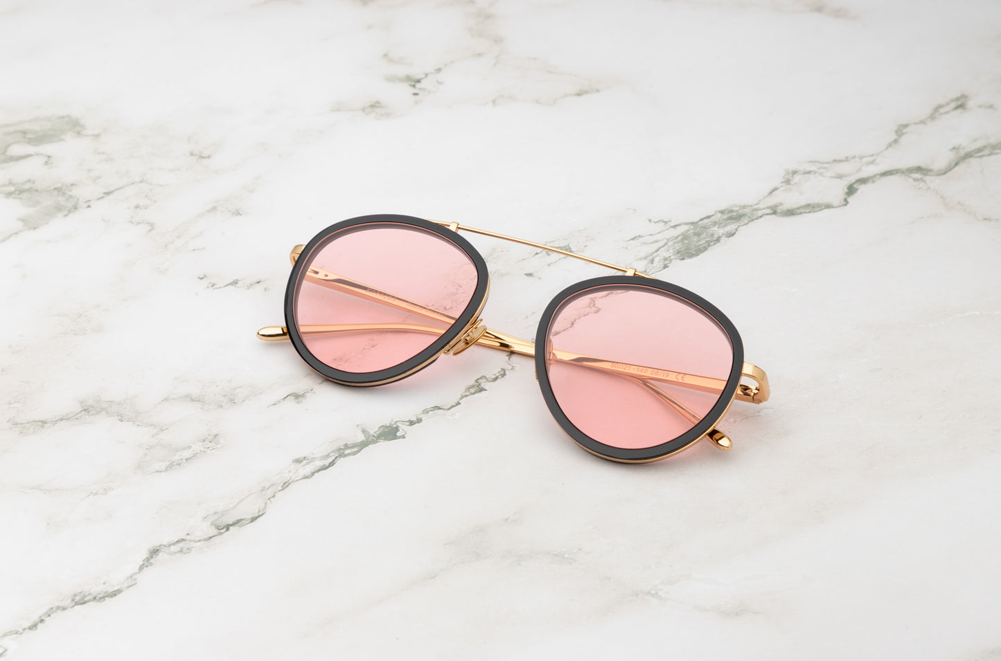 The strong, clean lines of the Sasha Davidov pink aviator sunglasses design.