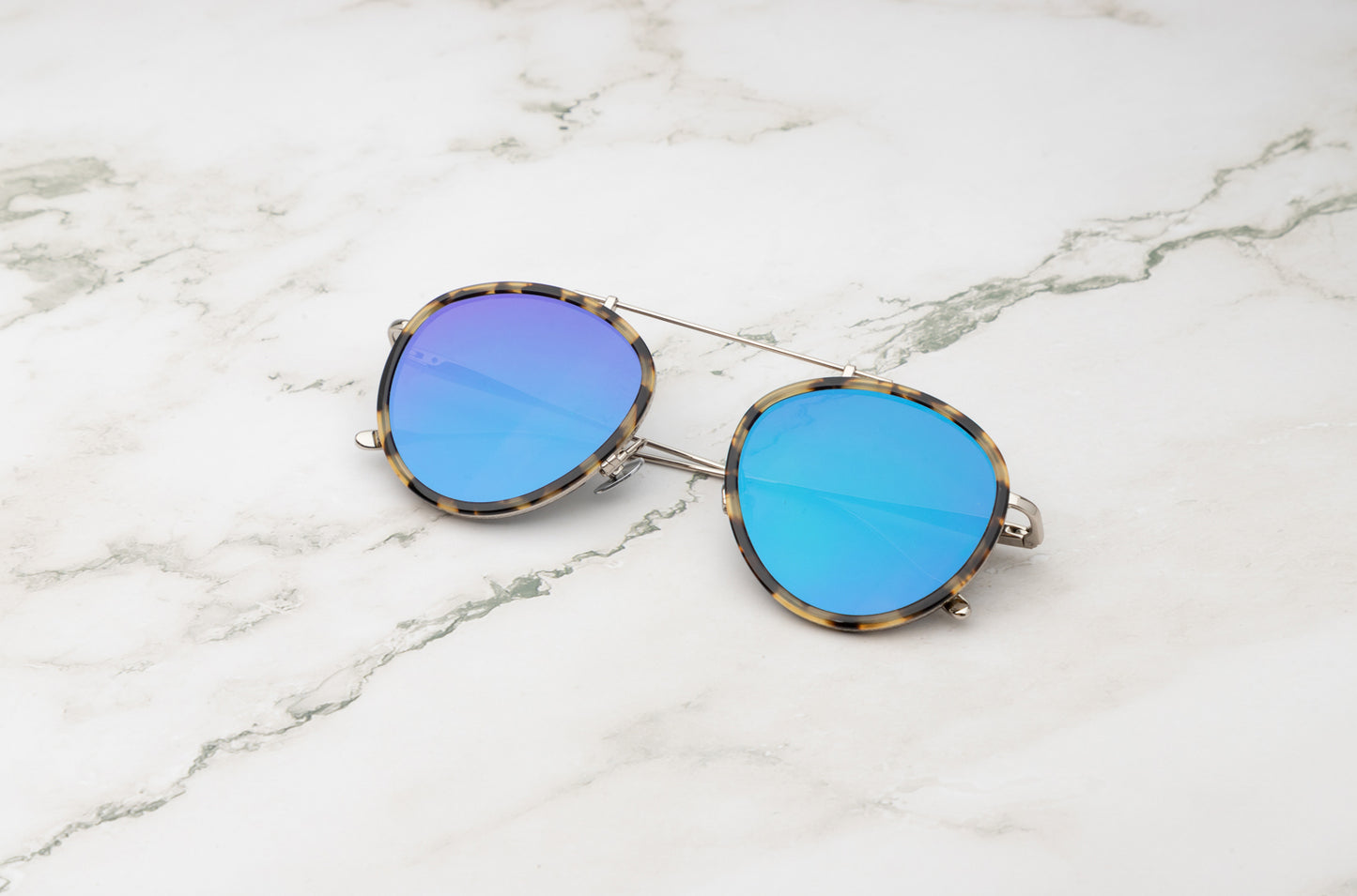 The Kopajos Sasha Davidov, combining a square aviator frame with mirrored lenses.