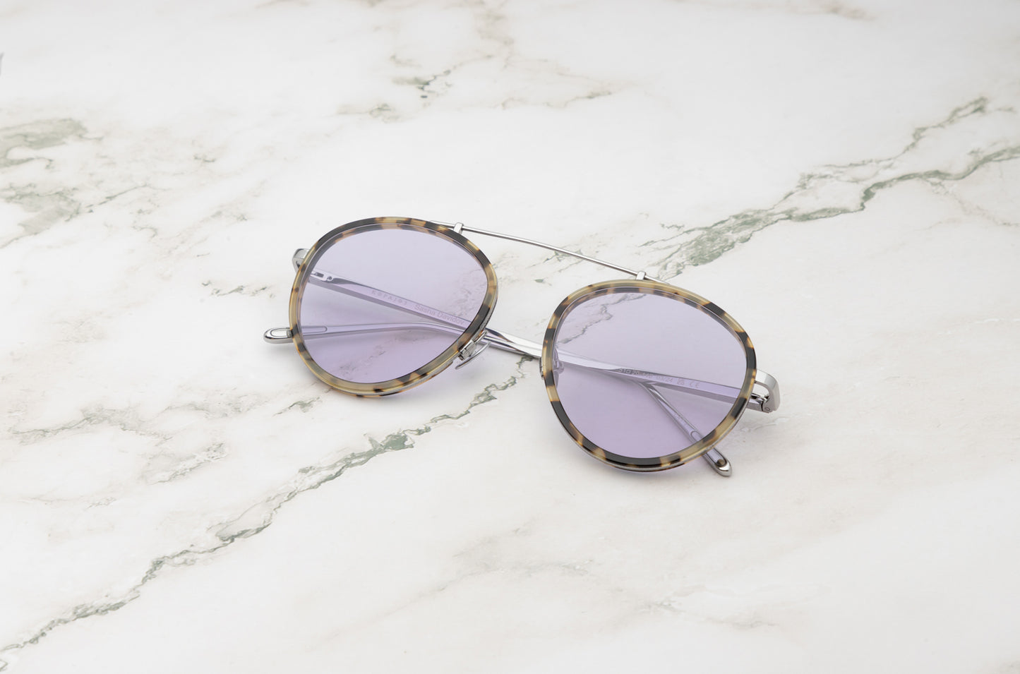 The ultimate travel gear: Kopajos Sasha Davidov dark aviator sunglasses.