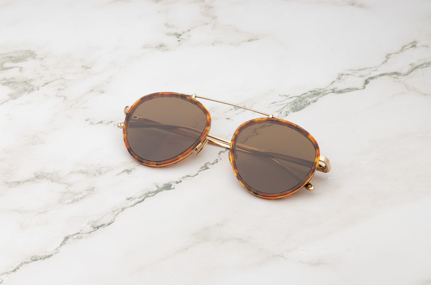 The Sasha Davidov sunglasses, featuring dark lenses for maximum UV protection and style.