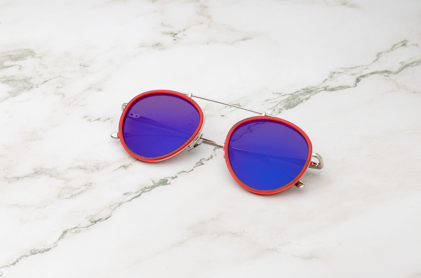 Sasha Davidov mirrored aviator sunglasses.