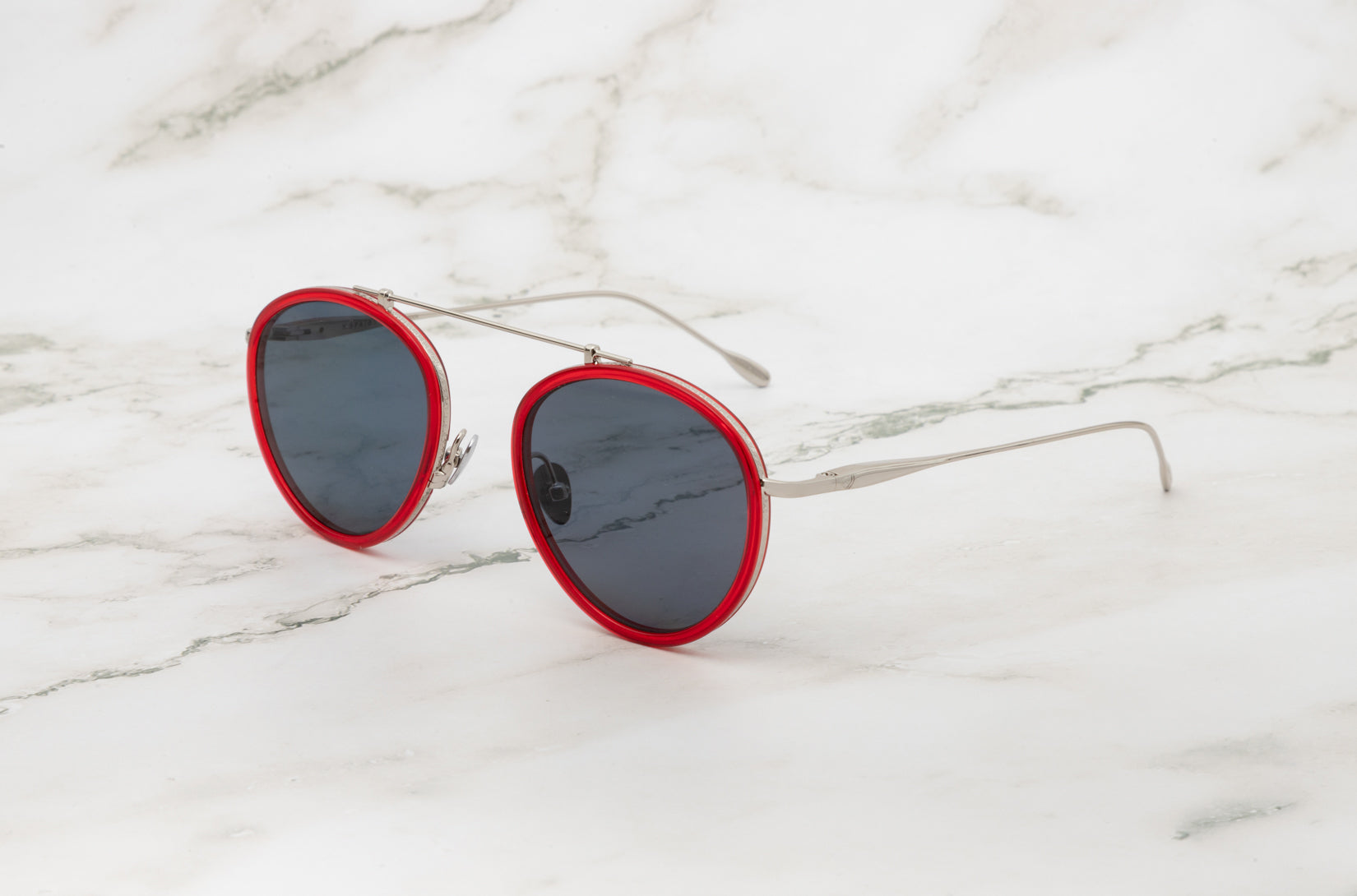 The sleek and versatile Kopajos Sasha Davidov silver and red aviator sunglasses.