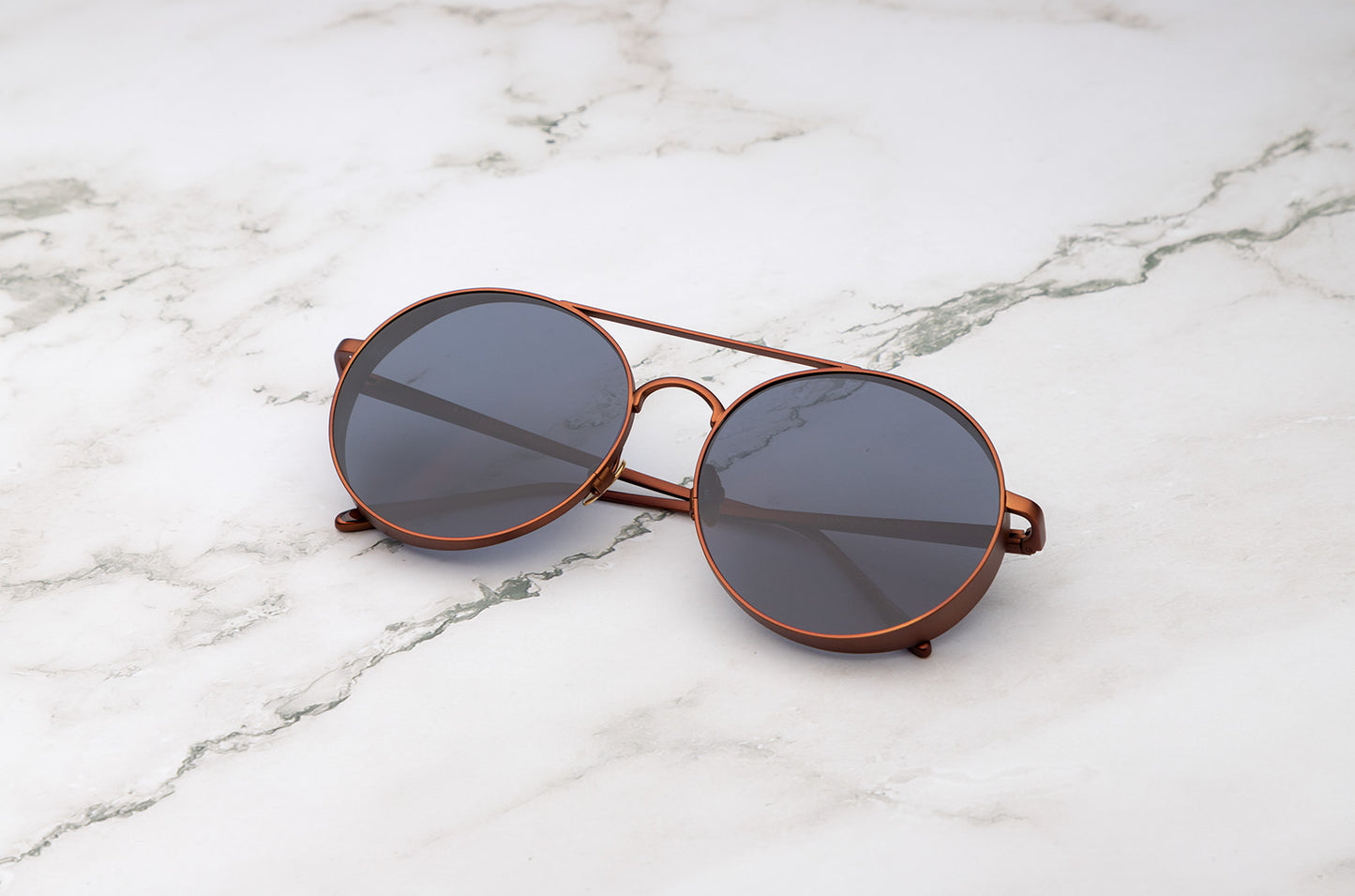 Make a bold statement with the Kopajos Thunderball large round sunglasses.
