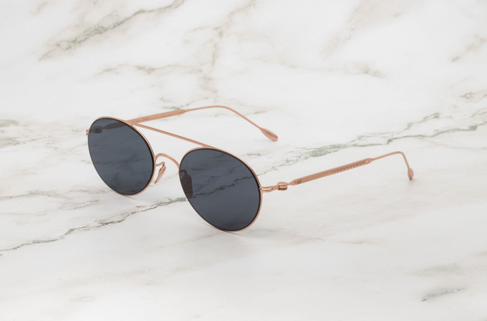 The Tracy by Kopajos, a perfect example of refined round style sunglasses.
