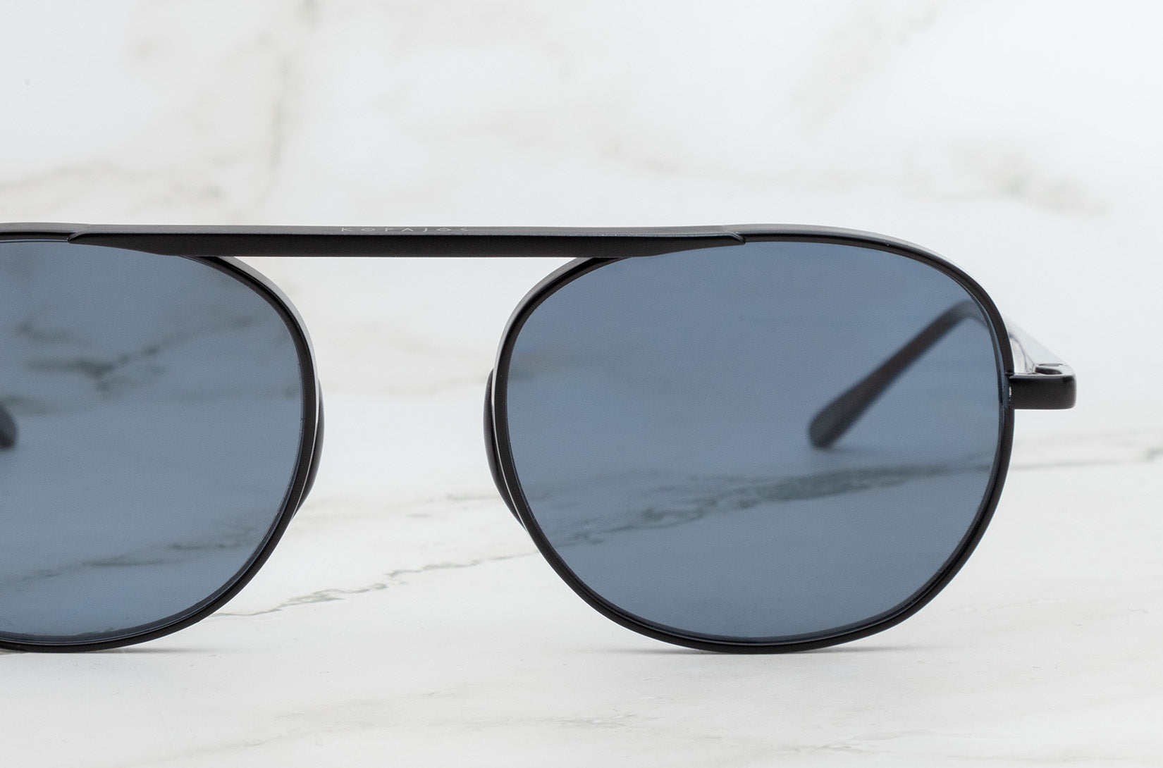 The classic Kopajos Willard White round sunglasses for men.