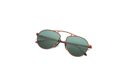 Kopajos bronze aviator sunglasses for men and women with green polarized lenses.