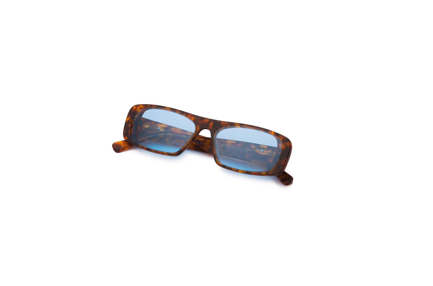 Diogo Ferreira mask sunglasses on a Santorini beach.