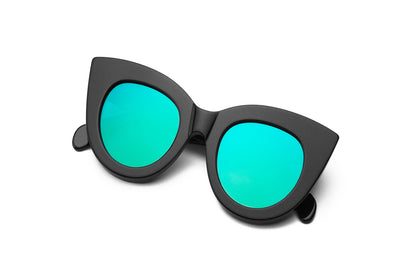 A woman wearing the oversized Fiona Volpe cat-eye sunglasses.