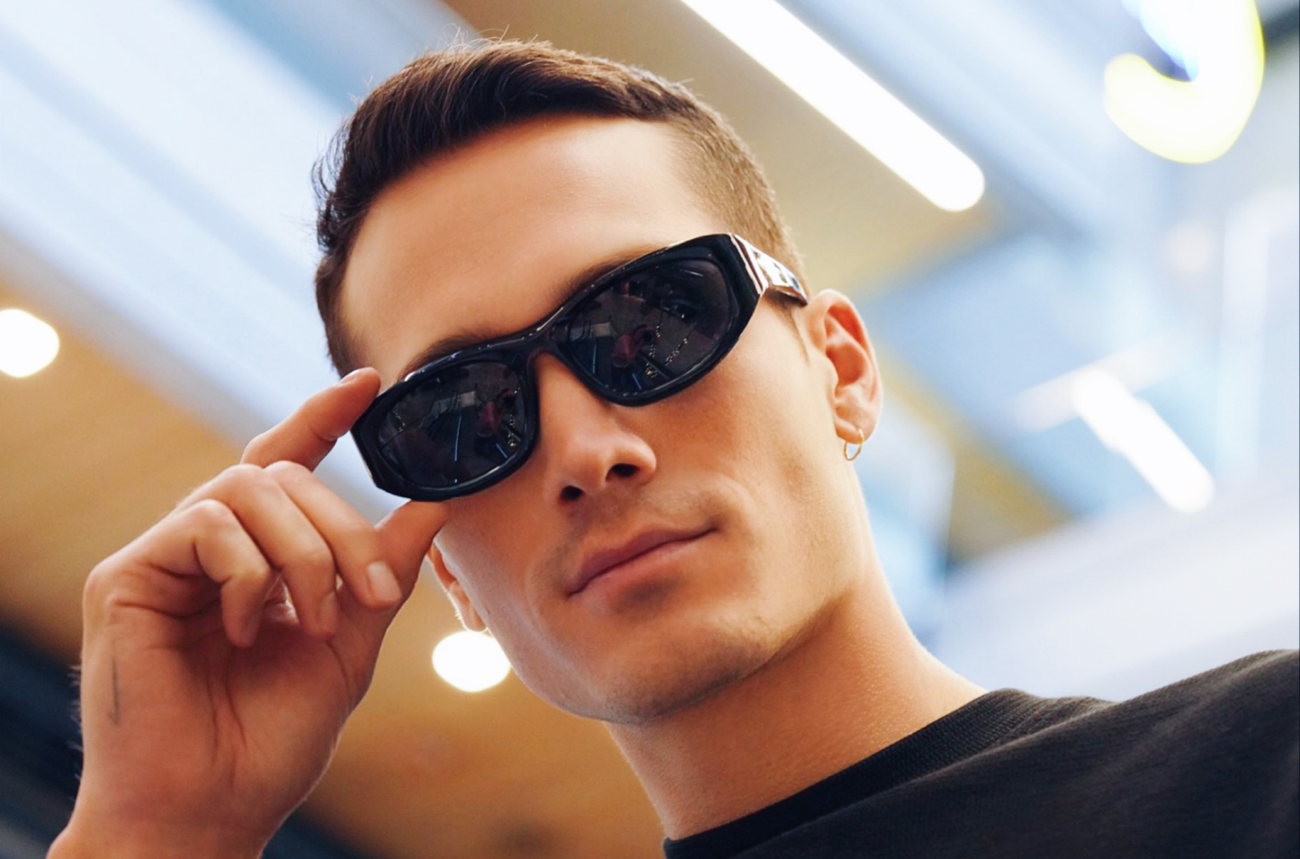 Model showcasing Gogol mask sunglasses by Kopayos featuring dark polarized lenses.