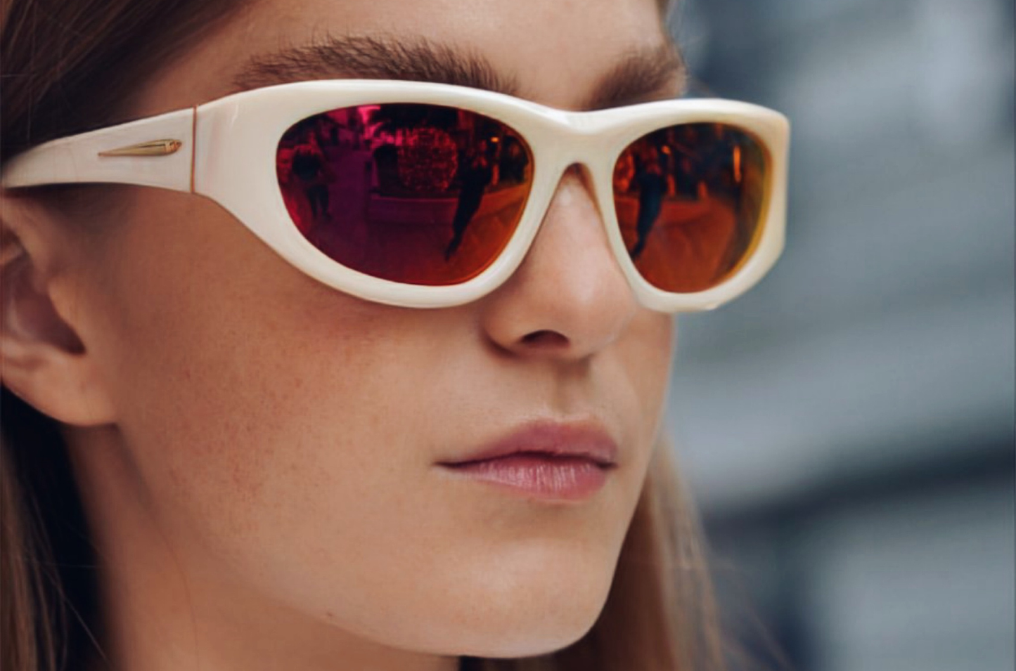 Model showcasing Gogol mask sunglasses by Kopayos featuring white frame and colorful polarized lenses.