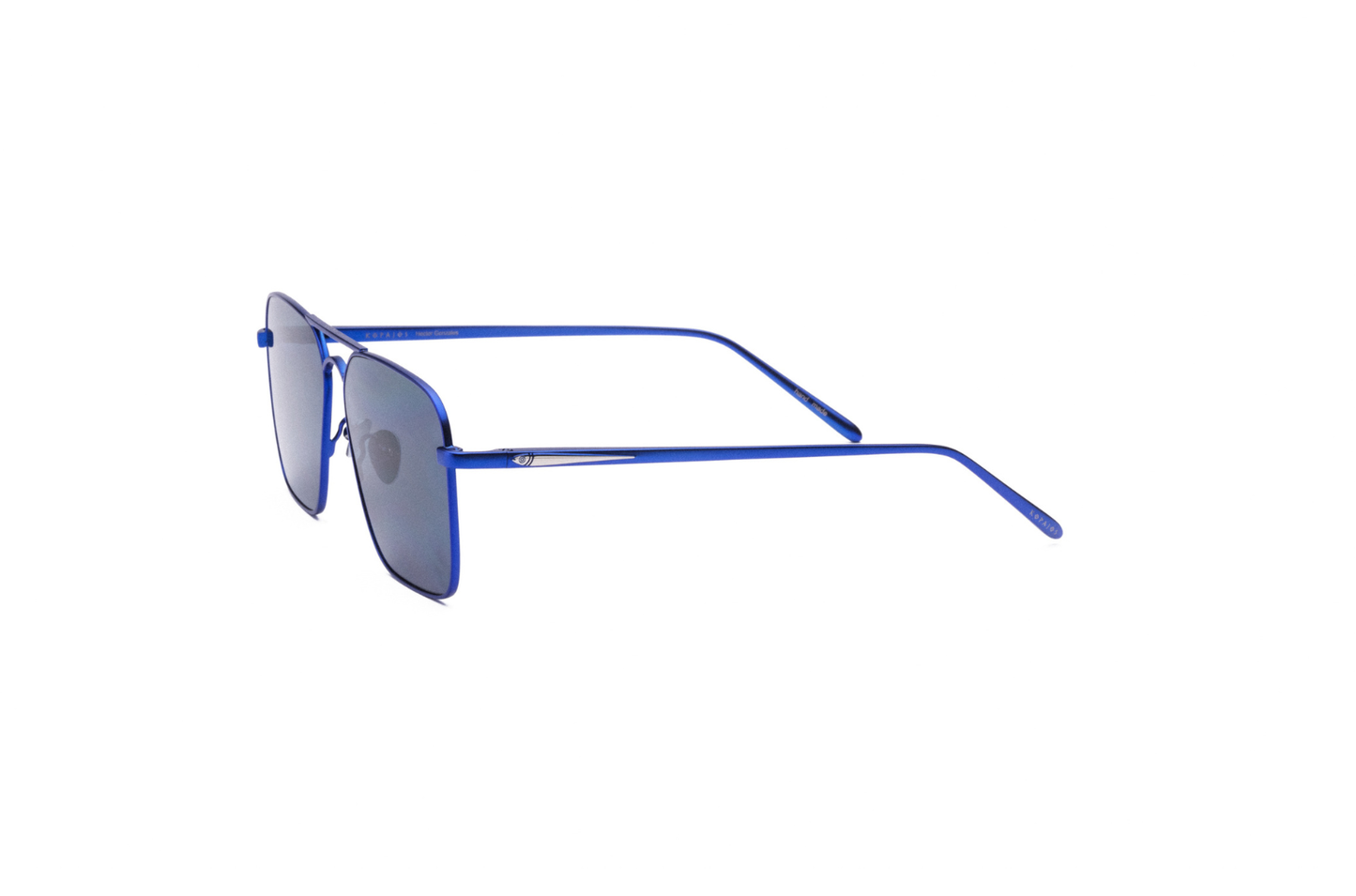 Profile shot of blue-frame Hector Gonzales aviator sunglasses by Kopajos with dark polarized lenses.