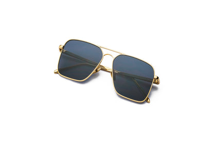 Top view of Hector Gonzales aviator sunglasses by Kopajos for men and women with gold frame, dark polarized lenses, and folded temples.