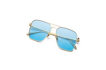 Top view of Hector Gonzales aviator sunglasses by Kopajos for men and women with gold frame, light blue polarized lenses, and folded temples.