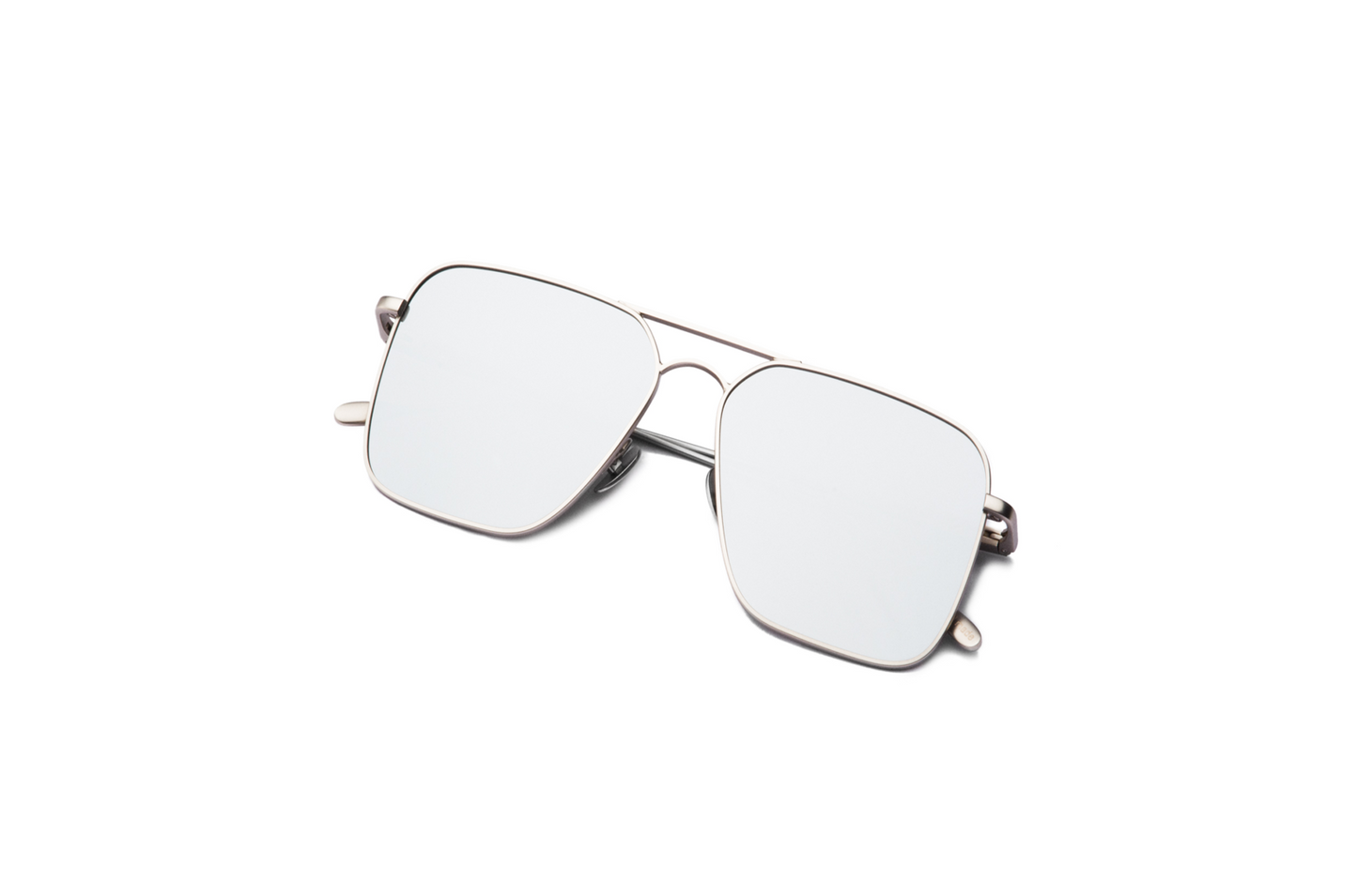 Top view of Hector Gonzales aviator sunglasses by Kopajos for men and women with silver frame, mirrored polarized lenses, and folded temples.