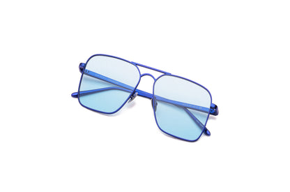 Top view of Hector Gonzales aviator sunglasses by Kopajos for men and women with blue frame, light blue transparent polarized lenses, and folded temples.