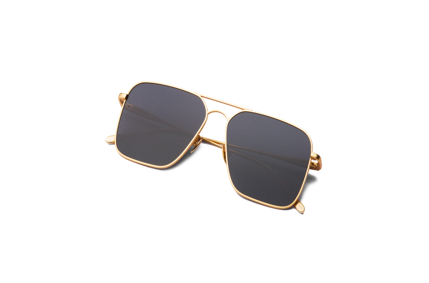 Top view of Hector Gonzales aviator sunglasses by Kopajos for men and women with gold frame, dark polarized lenses, and folded temples.