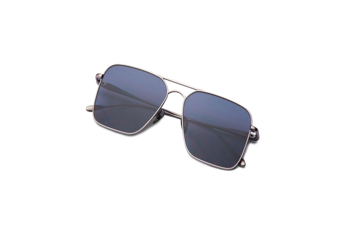 Top view of Hector Gonzales aviator sunglasses by Kopajos for men and women with silver frame, dark polarized lenses, and folded temples.