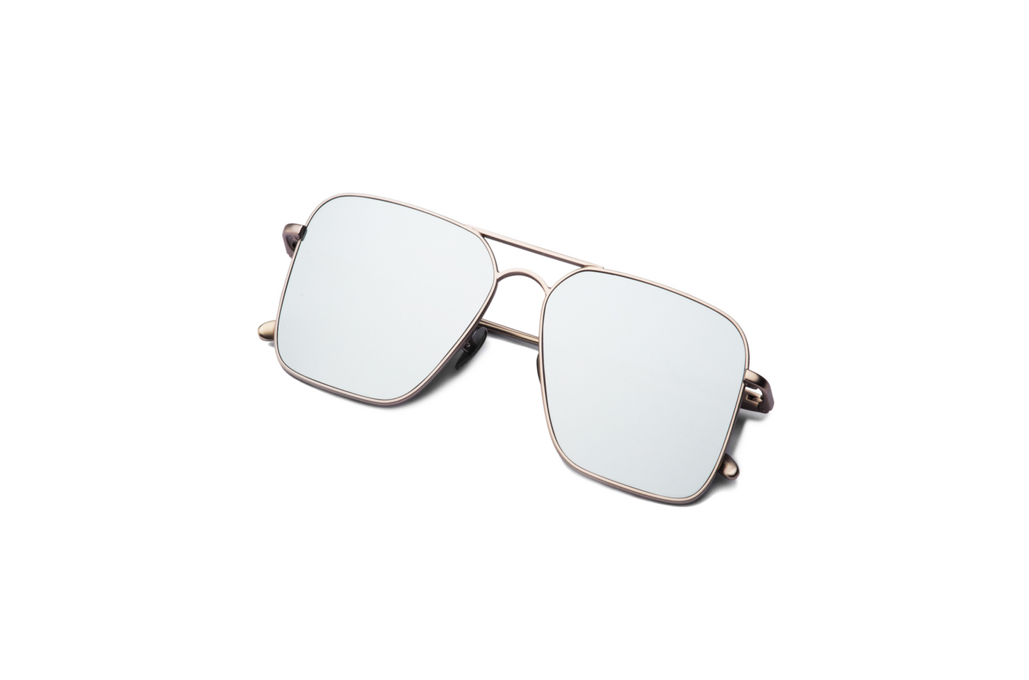 Overhead view of Hector Gonzales aviator sunglasses by Kopajos for men and women, featuring silver frame, light mirrored polarized lenses, and folded temples.