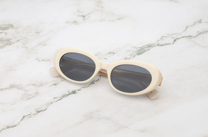 Lina round sunglasses by Kopajos with white frame and dark lenses for men and women.