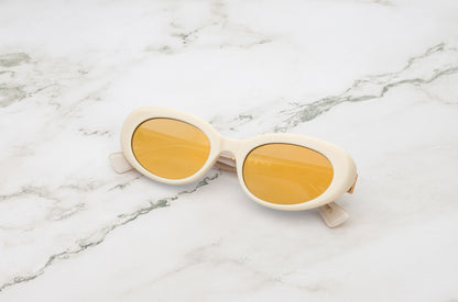 Lina round sunglasses by Kopajos with white frame and gold mirrored polarized lenses for men and women.
