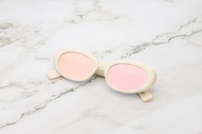 Lina round sunglasses by Kopajos with white frame and pink mirrored polarized lenses for men and women.