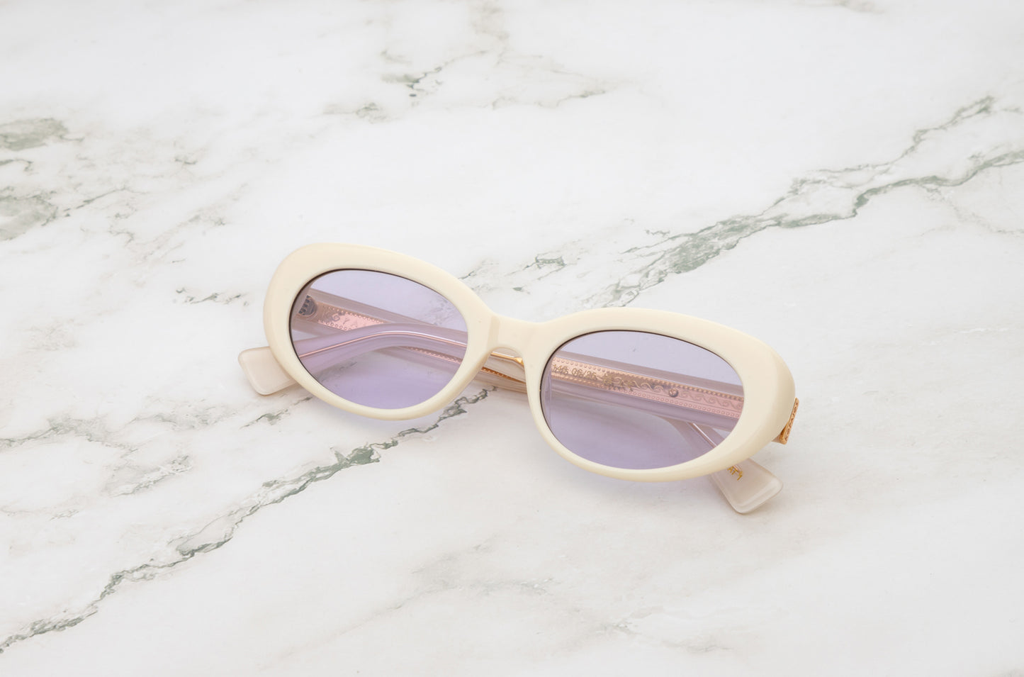 Lina round sunglasses by Kopajos with white frame and transparent purple polarized lenses for men and women.