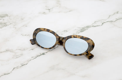 Lina round sunglasses by Kopajos with leopard frame and silver mirrored polarized lenses for men and women.