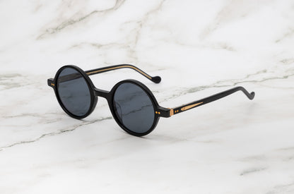 Side view of the Kopajos Petra round sunglasses for men.