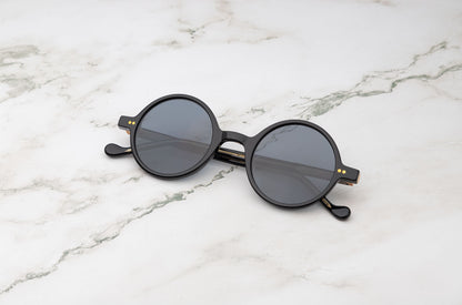 The Kopajos Petra, tiny round sunglasses with a chic, international feel.