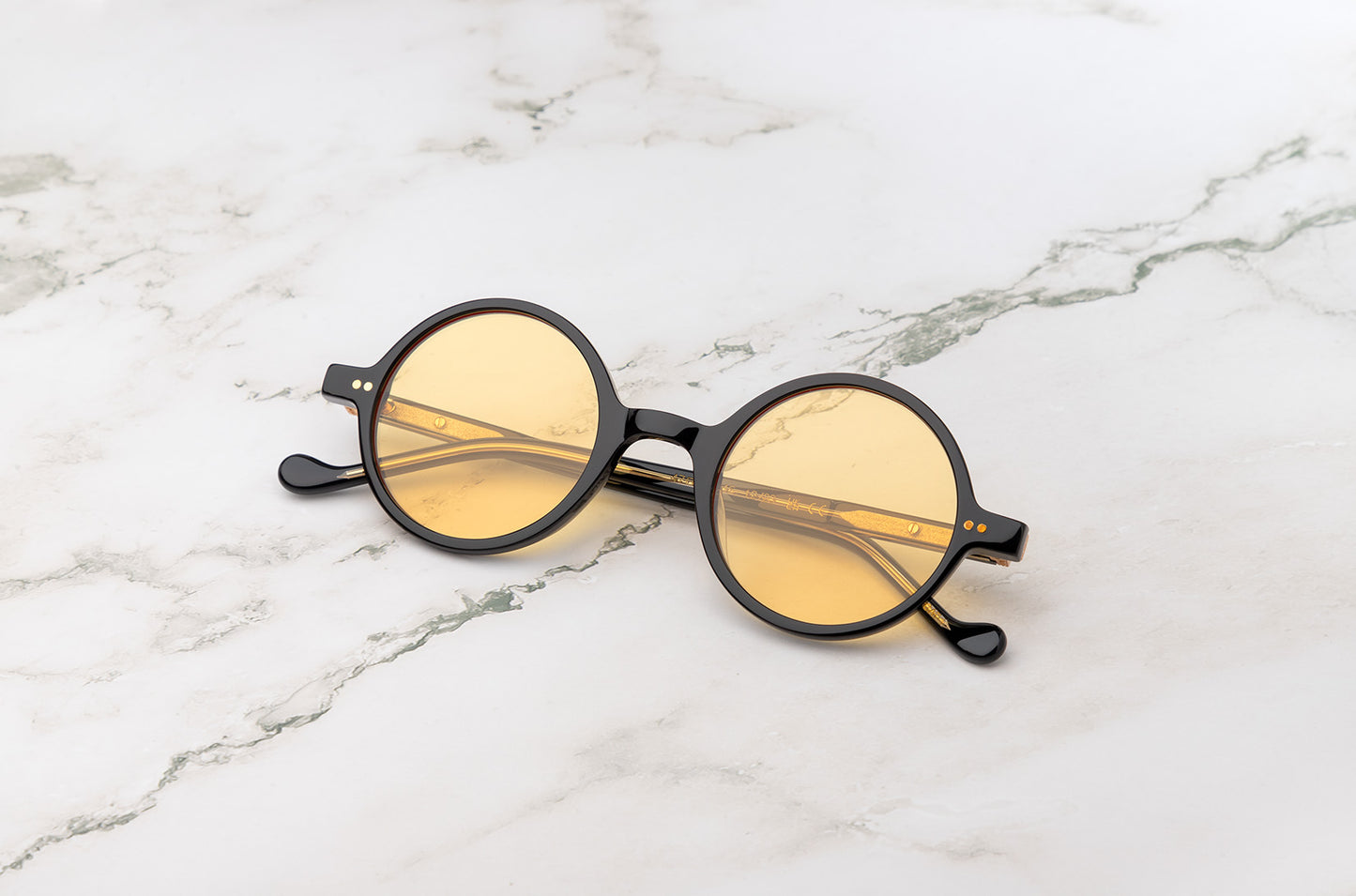 The classic black round sunglasses look, perfected by the Kopajos Petra.