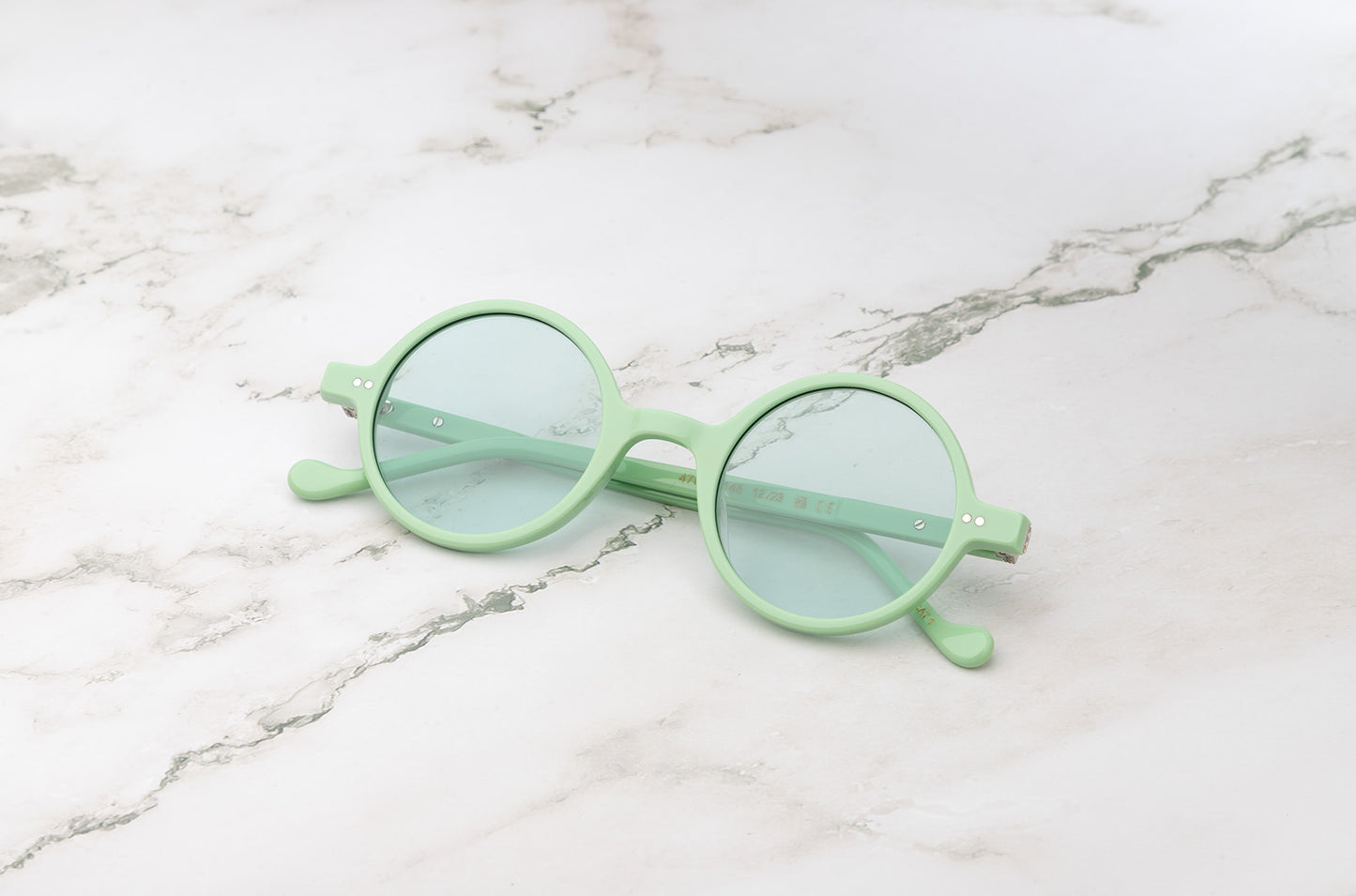 The Kopajos Petra sunglasses with light green frame and lenses